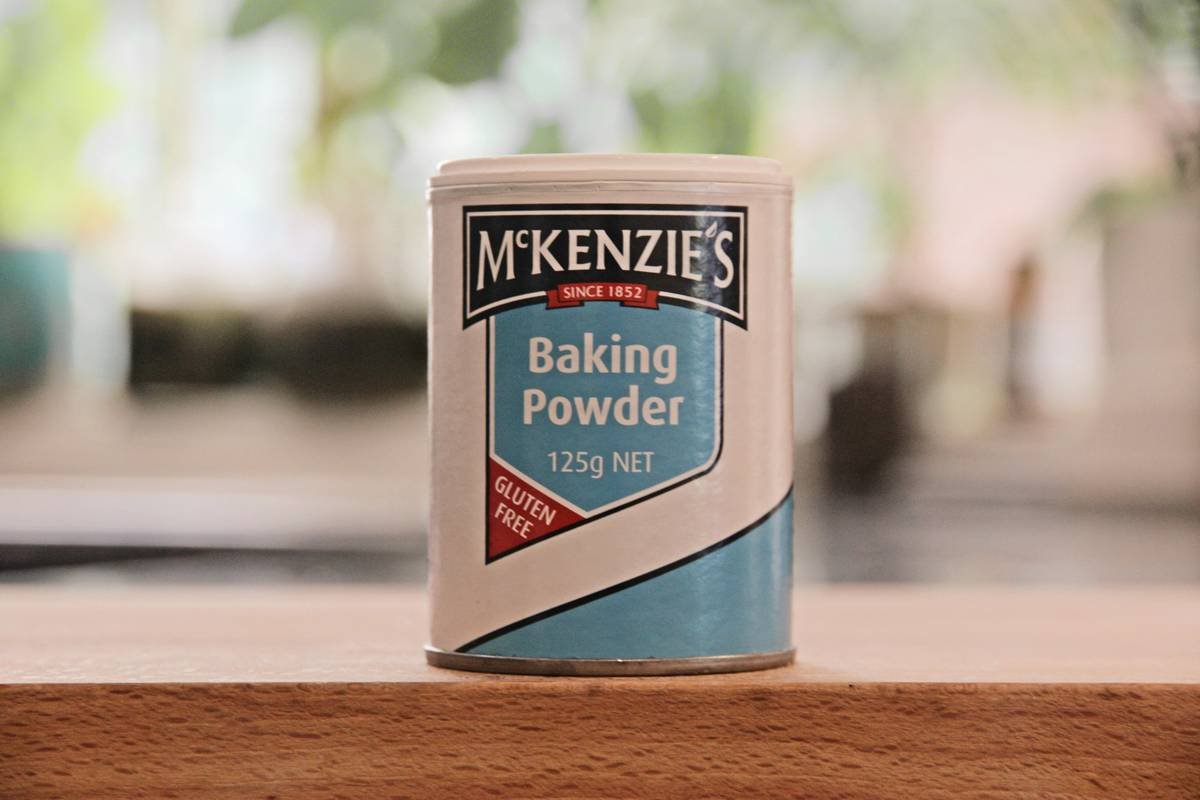 Stainless steel bread flour tin with oxygen absorber on kitchen counter